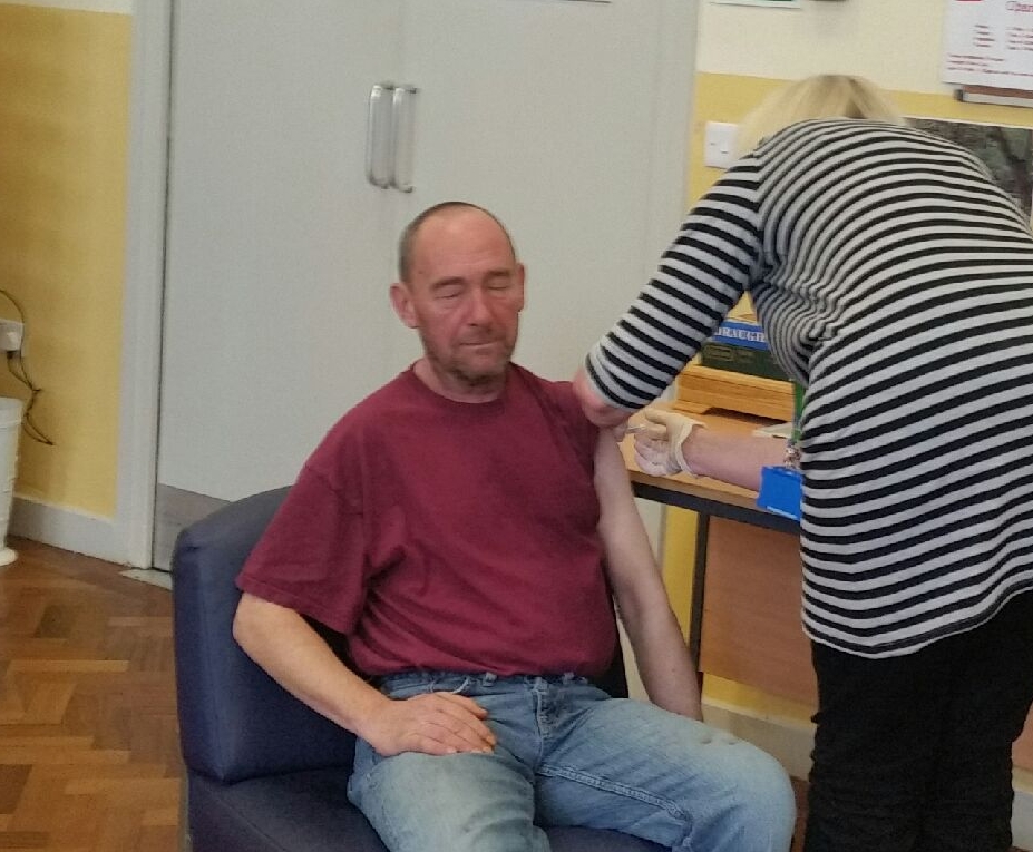 A guest recieving his flu jab - this ran within the centre and was so popular the NHS support ran out of flu vaccinations and another clinic was needed.